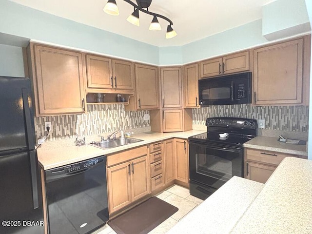 2800 N Atlantic Ave Unit 1206, Daytona Beach, FL 32118 - kitchen with black appliances, a sink, light countertops, and tasteful backsplash