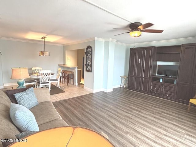 2800 N Atlantic Ave Unit 1206, Daytona Beach, FL 32118 - living area featuring crown molding, baseboards, and ceiling fan