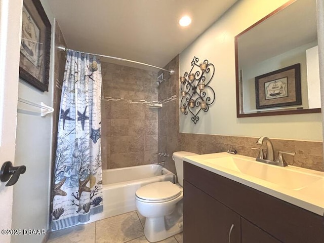 2800 N Atlantic Ave Unit 1206, Daytona Beach, FL 32118 - full bathroom with tile patterned floors, toilet, shower / bath combo with shower curtain, vanity, and recessed lighting