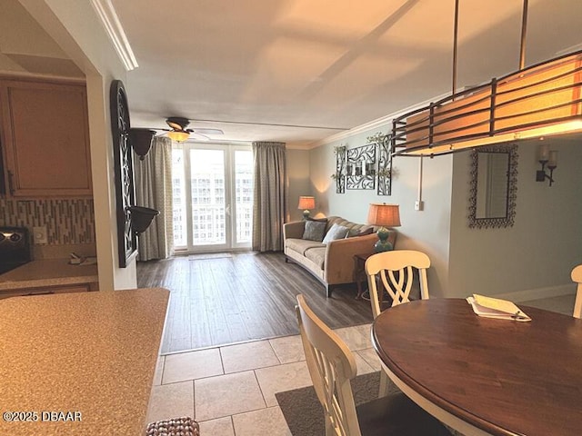 2800 N Atlantic Ave Unit 1206, Daytona Beach, FL 32118 - dining room featuring crown molding, ceiling fan, and tile patterned floors