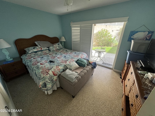 carpeted bedroom with access to exterior and ceiling fan