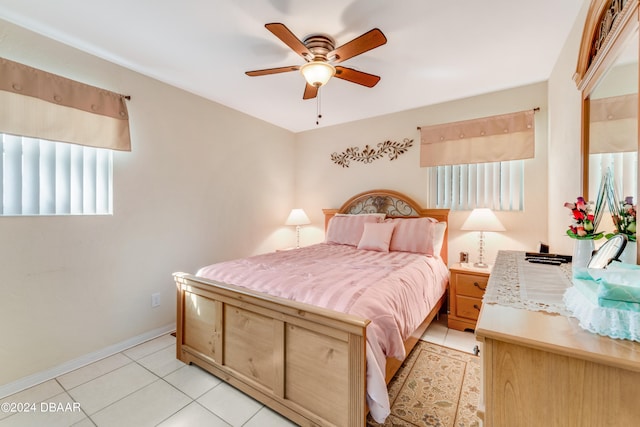 tiled bedroom with ceiling fan