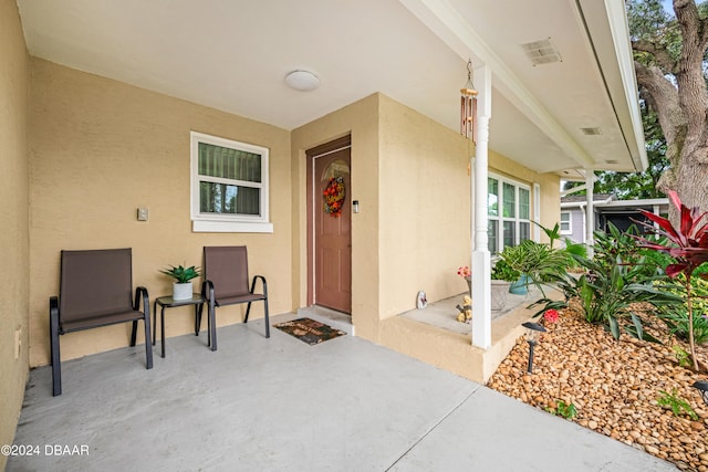 entrance to property with a patio area