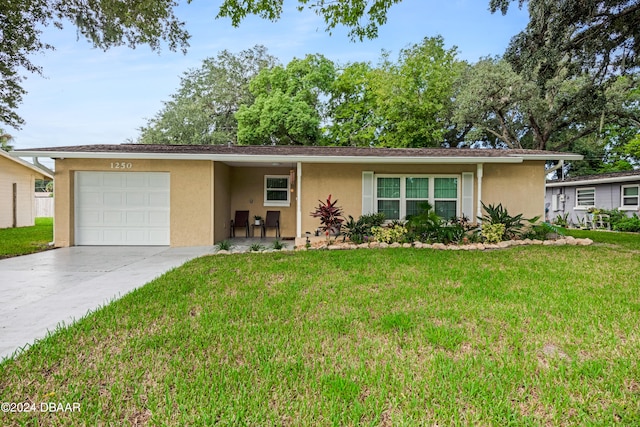 single story home with a garage and a front yard