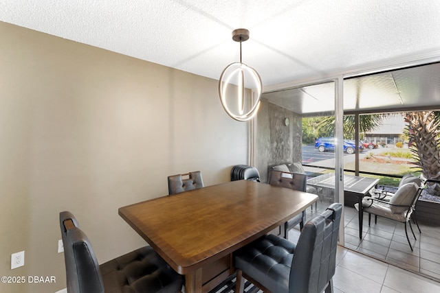 5500 Ocean Shore Blvd Unit 58, Ormond Beach, FL 32176 - dining space with light tile patterned flooring and a textured ceiling
