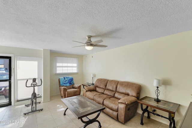 5500 Ocean Shore Blvd Unit 58, Ormond Beach, FL 32176 - living area featuring a ceiling fan, light tile patterned flooring, and a textured ceiling
