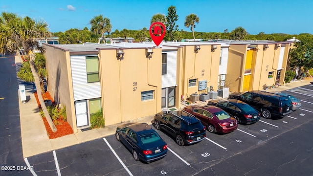 5500 Ocean Shore Blvd Unit 58, Ormond Beach, FL 32176 - view of property with uncovered parking and central AC