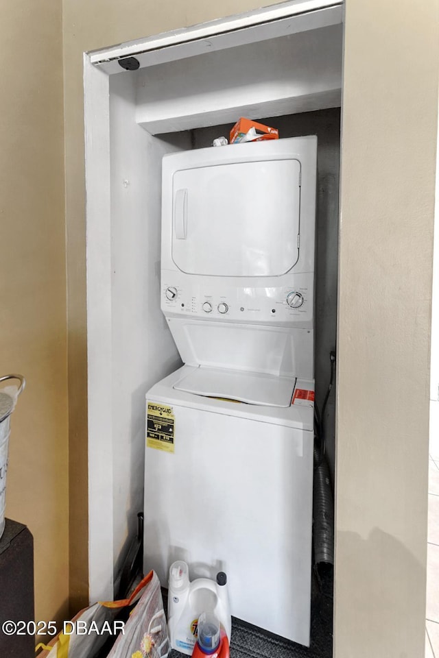 5500 Ocean Shore Blvd Unit 58, Ormond Beach, FL 32176 - washroom featuring estacked washer and dryer