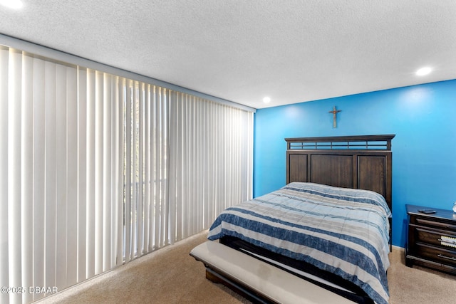 5500 Ocean Shore Blvd Unit 58, Ormond Beach, FL 32176 - carpeted bedroom with a textured ceiling and recessed lighting