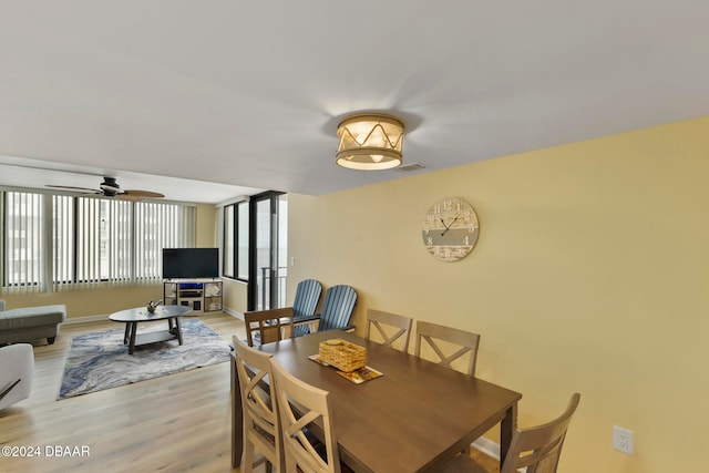 dining space featuring light hardwood / wood-style flooring and ceiling fan