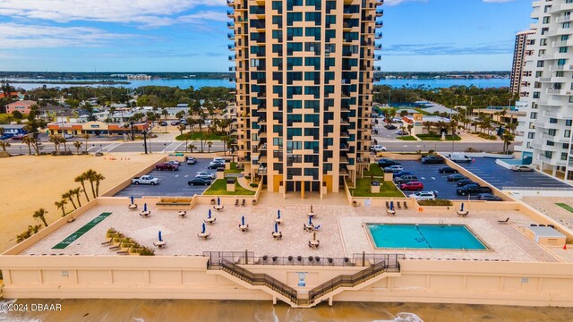 birds eye view of property with a water view