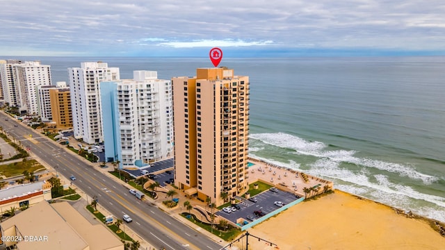 drone / aerial view featuring a view of the beach and a water view