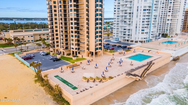 aerial view featuring a water view and a view of the beach