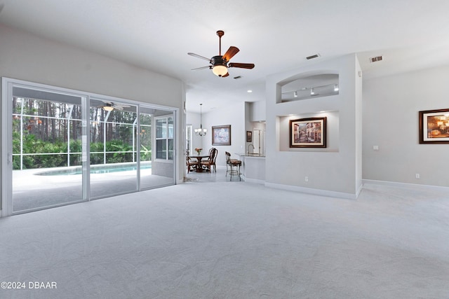 1317 Harwick Ln, Ormond Beach, FL 32174 - unfurnished living room with a ceiling fan, carpet, and baseboards