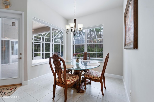 1317 Harwick Ln, Ormond Beach, FL 32174 - dining area with a chandelier, baseboards, and light tile patterned flooring