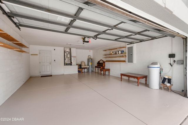 garage featuring electric panel, electric water heater, a garage door opener, and heating unit