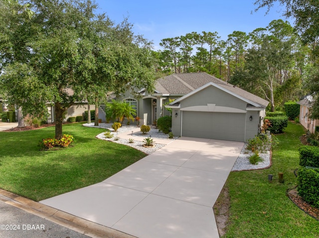 1317 Harwick Ln, Ormond Beach, FL 32174 - view of front of home with a garage, driveway, a front lawn, and stucco siding