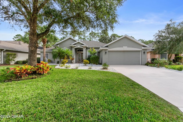1317 Harwick Ln, Ormond Beach, FL 32174 - ranch-style house with stucco siding, an attached garage, driveway, and a front lawn