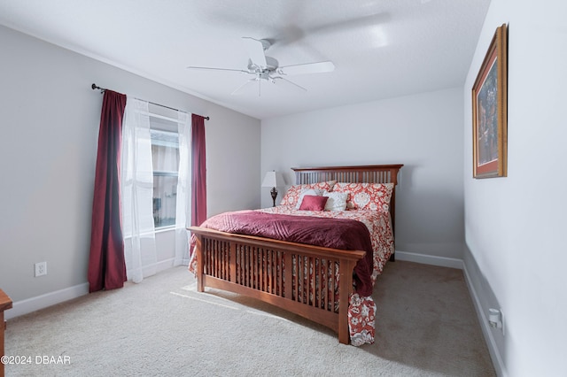 bedroom with ceiling fan and carpet