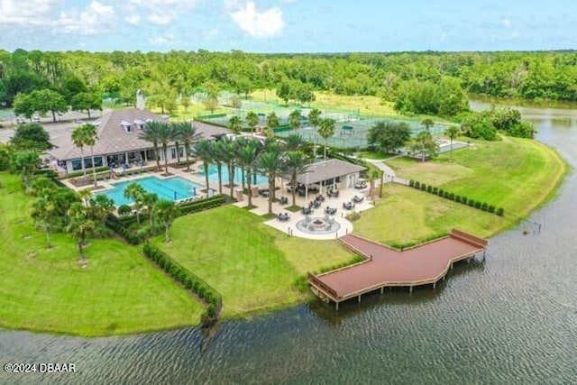 1317 Harwick Ln, Ormond Beach, FL 32174 - aerial view of a pool, a nearby body of water, and a heavily wooded area