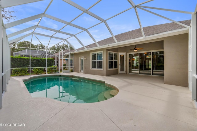1317 Harwick Ln, Ormond Beach, FL 32174 - outdoor pool featuring a patio, ceiling fan, and a lanai