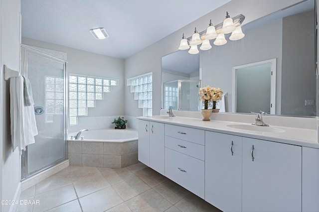 bathroom featuring tile patterned floors, vanity, and plus walk in shower