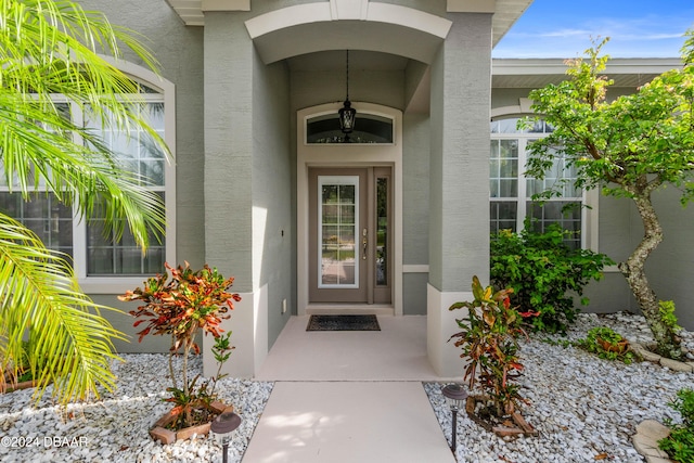 1317 Harwick Ln, Ormond Beach, FL 32174 - doorway to property with stucco siding