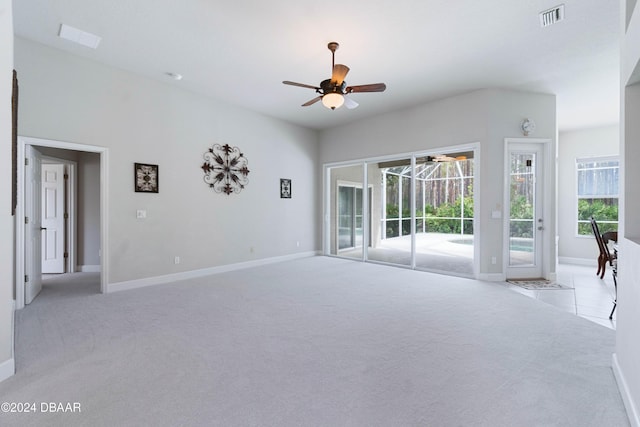 1317 Harwick Ln, Ormond Beach, FL 32174 - unfurnished living room with light carpet, a ceiling fan, and baseboards