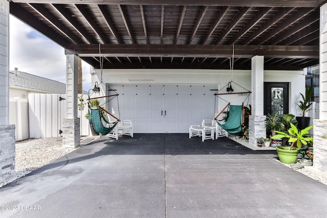 830 Maralyn Ave, New Smyrna Beach, FL 32169 - view of patio with driveway and a garage
