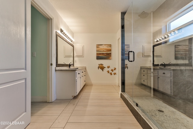 bathroom featuring vanity and a shower with shower door