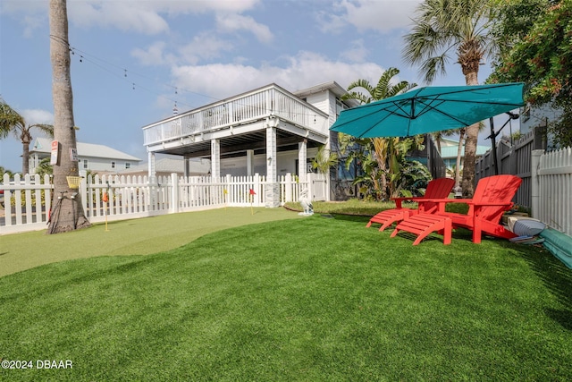 830 Maralyn Ave, New Smyrna Beach, FL 32169 - view of yard featuring an area to practice putting and a deck