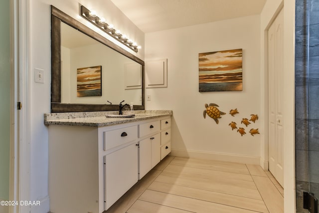 bathroom featuring hardwood / wood-style flooring and vanity