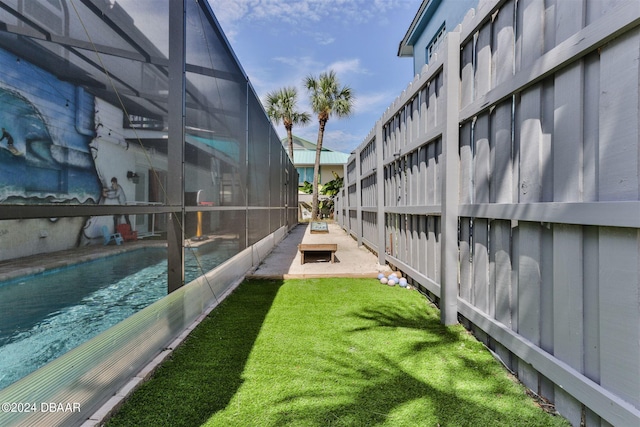 830 Maralyn Ave, New Smyrna Beach, FL 32169 - view of yard with an outdoor pool and a lanai