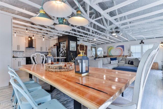 dining area featuring light wood-type flooring and ceiling fan