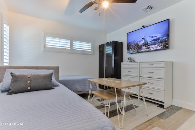 830 Maralyn Ave, New Smyrna Beach, FL 32169 - bedroom featuring light wood-type flooring, a ceiling fan, and baseboards