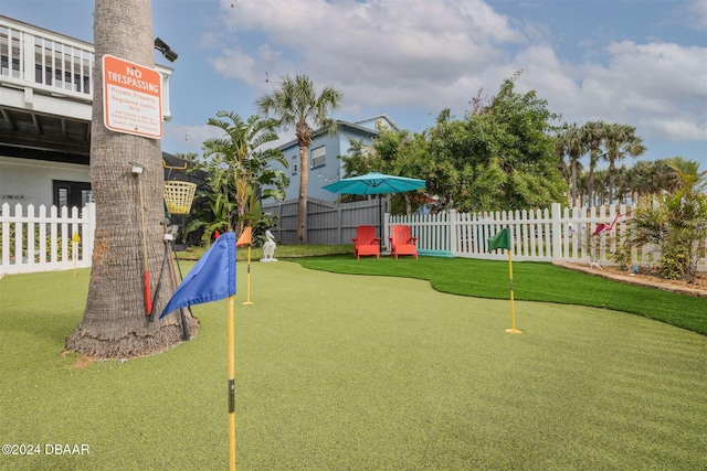 830 Maralyn Ave, New Smyrna Beach, FL 32169 - view of playground with fence and a putting area