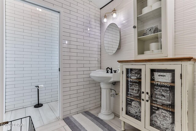 bathroom featuring tile walls and tile patterned flooring