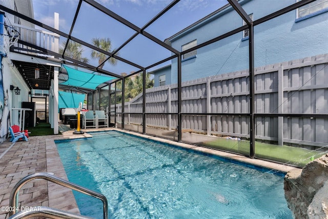 830 Maralyn Ave, New Smyrna Beach, FL 32169 - view of swimming pool with a lanai, a patio area, and fence