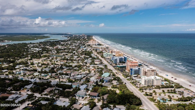 aerial view featuring a view of the beach and a water view