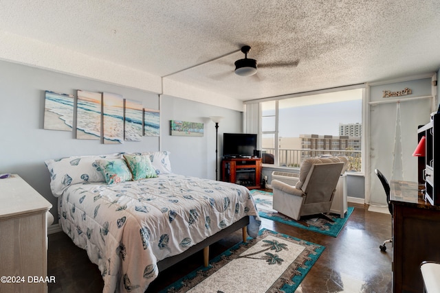 bedroom with ceiling fan, a textured ceiling, and floor to ceiling windows