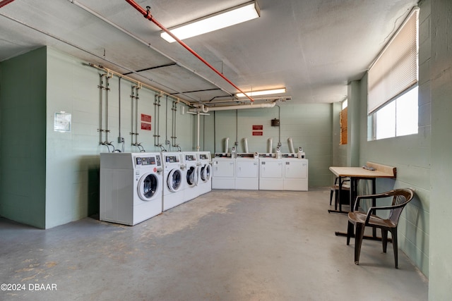 800 N Atlantic Ave Unit 516, Daytona Beach, FL 32118 - community laundry room with washing machine and dryer and concrete block wall