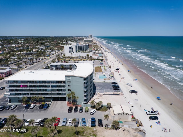 aerial view featuring a water view and a beach view