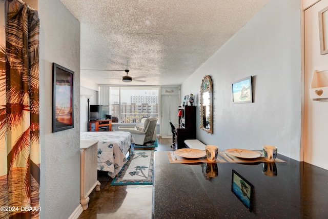 800 N Atlantic Ave Unit 516, Daytona Beach, FL 32118 - living room with a textured ceiling, ceiling fan, and a textured wall