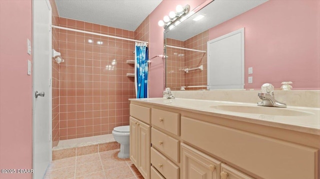 144 S Halifax Ave Unit 46, Daytona Beach, FL 32118 - bathroom with tile patterned floors, double vanity, toilet, a sink, and tiled shower