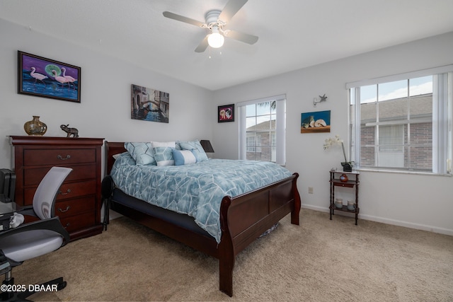 bedroom featuring light colored carpet, baseboards, and ceiling fan