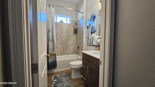 full bathroom with hardwood / wood-style flooring, vanity, shower / bath combination with curtain, and toilet