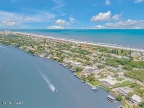 bird's eye view with a view of the beach and a water view