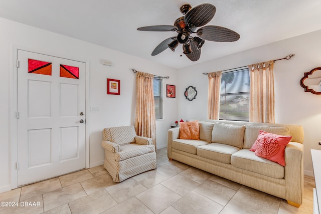 tiled living room featuring ceiling fan