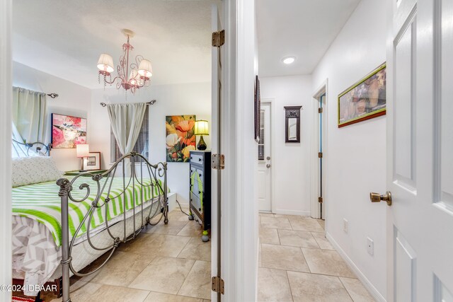 corridor featuring an inviting chandelier