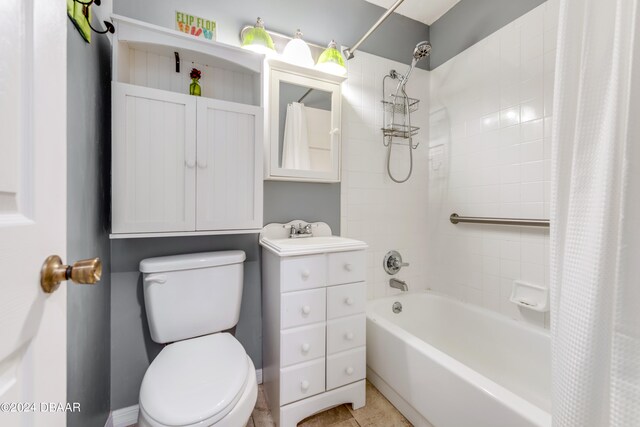 full bathroom featuring shower / bath combo, tile patterned flooring, sink, and toilet